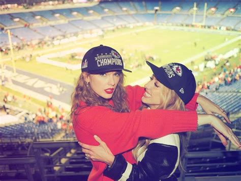 Taylor Swift and Brittany Mahomes pose in matching AFC Championship hats