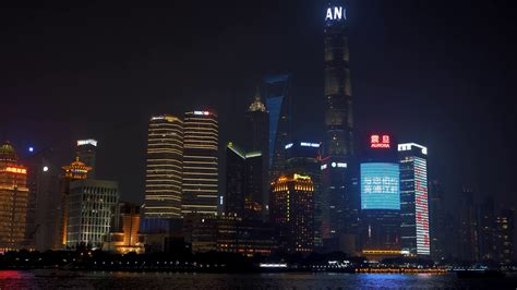 01 July, 2018 China, Shanghai. Night view of of Lujiazui skyline as seen from the Bund, across ...