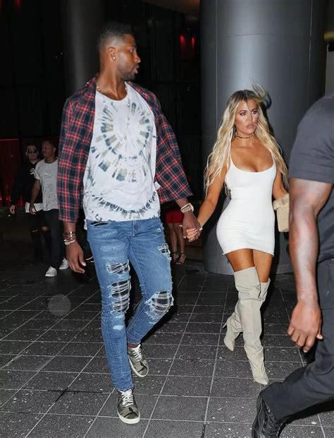 Khloe Kardashian holds hands with Tristan Thompson after sealing ...