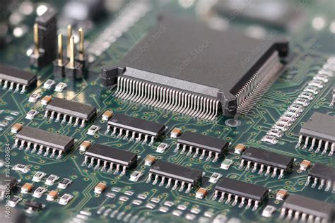 Green Circuit board with microprocessor and other electronic components Stock Photo | Adobe Stock