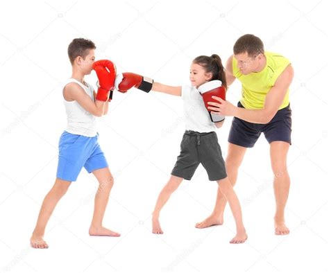 Cute little children training with boxing coach on white background — Stock Photo © belchonock ...