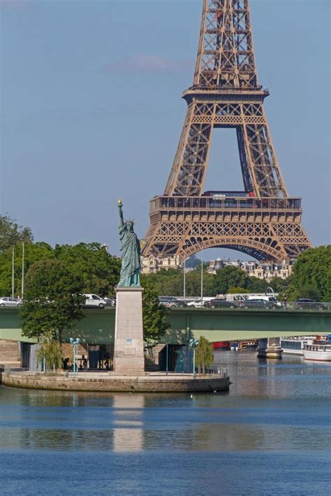 Statue of Liberty against Eiffel tower in Paris 21624687 Stock Photo at Vecteezy