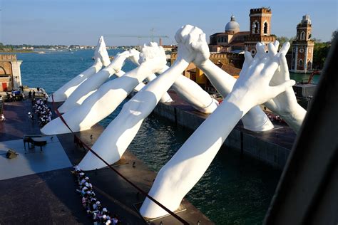 Lorenzo Quinn's Giant Hands Spread Message of Unity in Venice