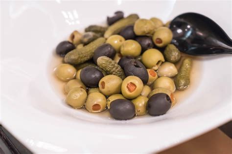 Olive pickle on white plate 3169903 Stock Photo at Vecteezy