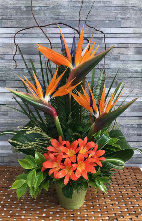 Bird of paradise tropical arrangement. #flowerarrangements | Large flower arrangements, Church ...