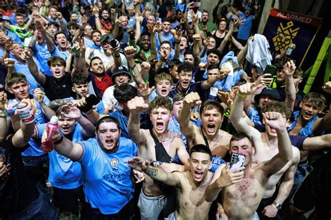 In pictures: Elated Manchester City fans celebrate into night after Champions League win ...