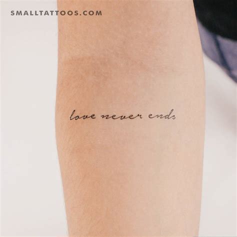 "Love Never Ends" temporary lettering tattoo located on