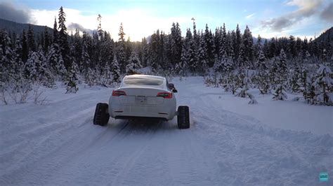 Watch A Tesla Model 3 Equipped With Snowtracks Traverse Over Snow With Ease