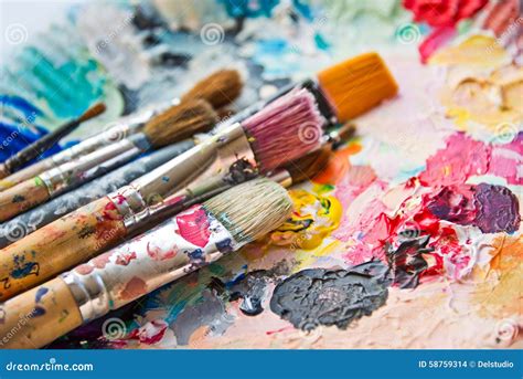 Used Paint Brushes on a Colorful Palette Stock Photo - Image of ...