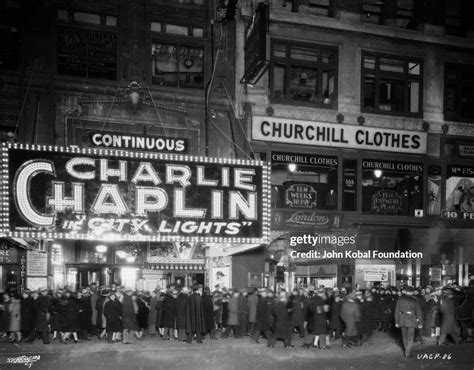 People flock to a cinema to see 'City Lights', the latest Charlie... News Photo - Getty Images