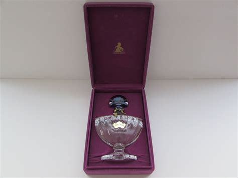 A beautiful vintage, empty Shalimar Perfume Bottle with original Purple velvet type box. This ...