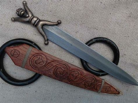 Celtic anthropomorphic short sword by Gullinbursti. Amazing work! | Celtic sword, Knife, Sword
