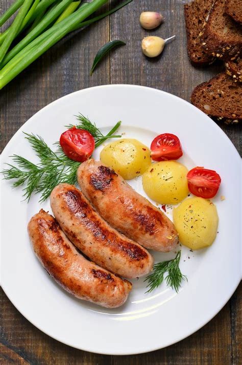 Fried Sausages and Boiled Potatoes Stock Photo - Image of nutrition, cook: 82482660