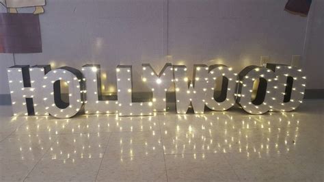 Cardboard Hollywood sign with LED Christmas lights | Led christmas lights, Sign lighting ...