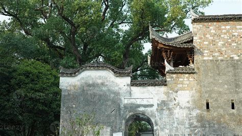 The beautiful traditional Chinese village view with the classical architecture and fresh green ...