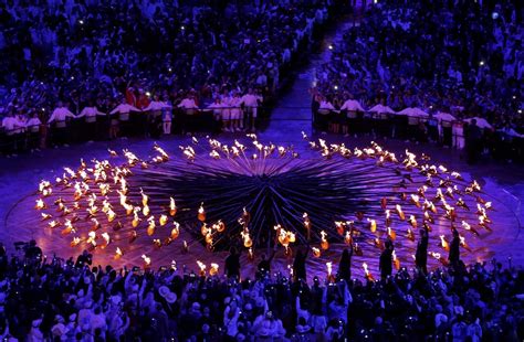 Reuters • The stems forming the Olympic Cauldron are lit by...