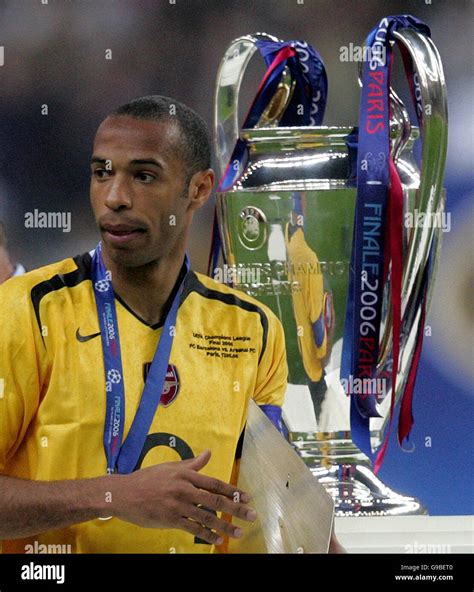 Arsenal's Thierry Henry walks past the trophy after the UEFA Champions League final at Stade de ...