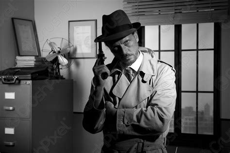 Film noir detective holding a revolver and posing - stock photo 620923 ...