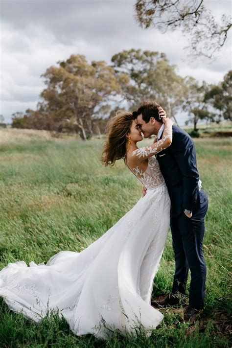 bride and groom windswept wedding photos - EmmaLovesWeddings