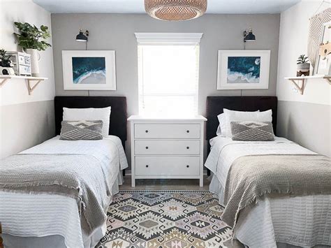 Bedroom with twin beds and ocean mural - sconces, water art, pale wood floor, aztec rug, french ...