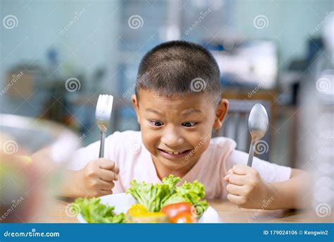 Happy Child Boy Eating Vegetables at Home. Stock Photo - Image of asian ...