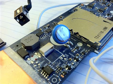 laptop motherboard "shorts" when connected to adapter - Super User