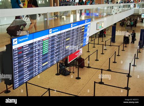 Arrivals and departures sign in Geneva airport Stock Photo - Alamy