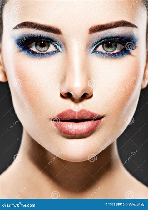 Beautiful Face of an Young Woman with Blue Makeup of Eyes Stock Photo ...