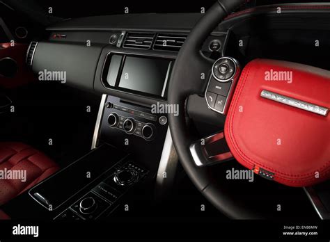 Range Rover Evoque Sport interior re-trimmed by Kahn Design in red and black Stock Photo - Alamy