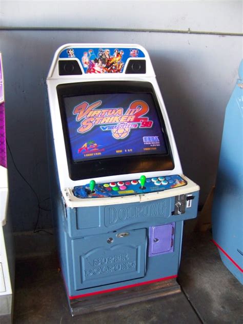 VIRTUA STRIKER 2 CANDY CABINET ARCADE GAME. . Item is in used condition. Evidence of wear an