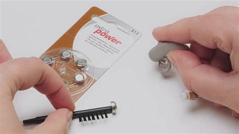 How to exchange a hearing aid battery EN - REXTON SLUŠNI APARATI - YouTube