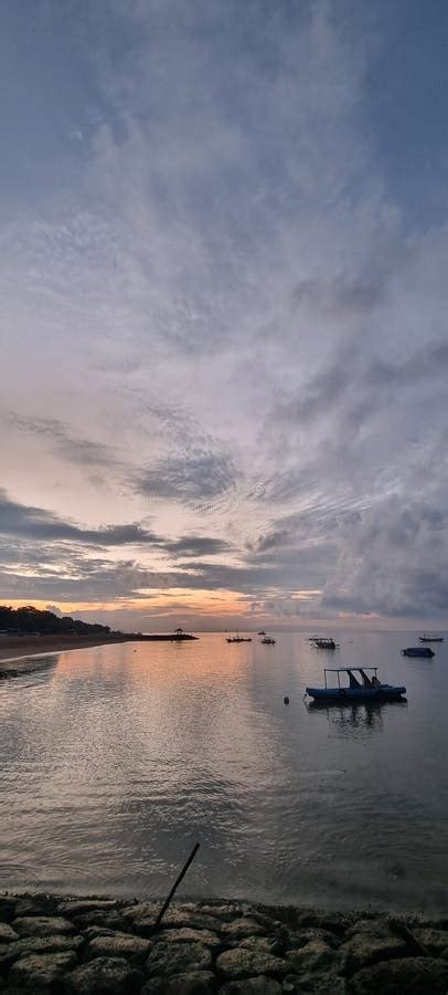 Sunrise at Sanur Beach Bali. Fisherman Paddling To the Shore. it Was Cloudy Morning Stock Image ...