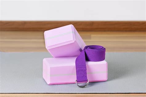 Premium Photo | Yoga blocks exercise mat and yoga belt for training ...