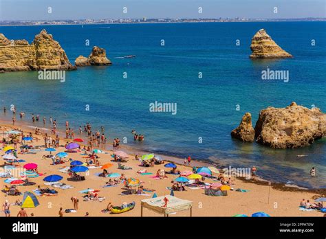 People at Dona Ana beach Stock Photo - Alamy