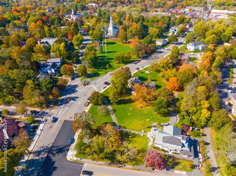 Lexington town center aerial view in fall including Visitor Center, Lexington Common and First ...