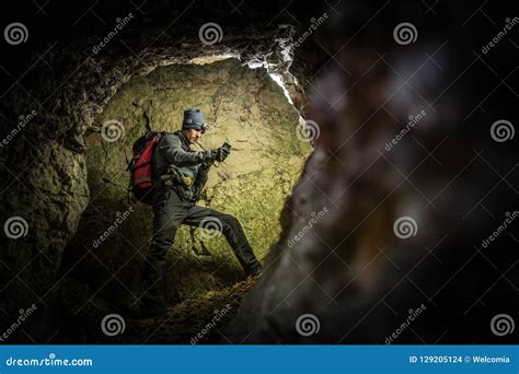 Deep Cave Exploration by Men Stock Photo - Image of exploring, exploration: 129205124