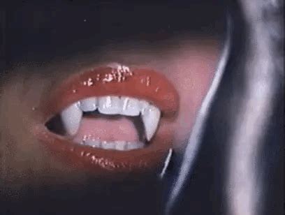 a woman's mouth with white teeth and red lipstick