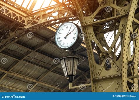 Vintage Clock and Lantern on Train Station with Building Roof Stock ...