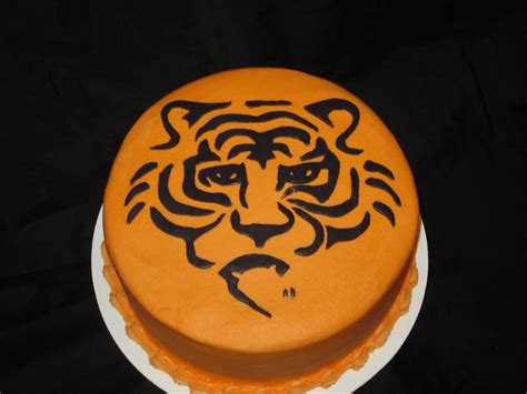 Tiger themed cake. To do this print a stencil and cut out the black lines (I use an exacto knife ...