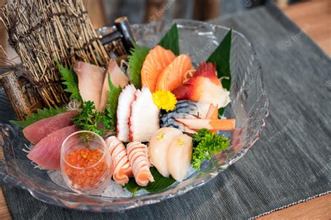 Premium Photo | Various japanese fresh sashimi fish and seafood set