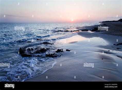 Sunset on the Pescoluse beach, Apulia, Italy Stock Photo - Alamy