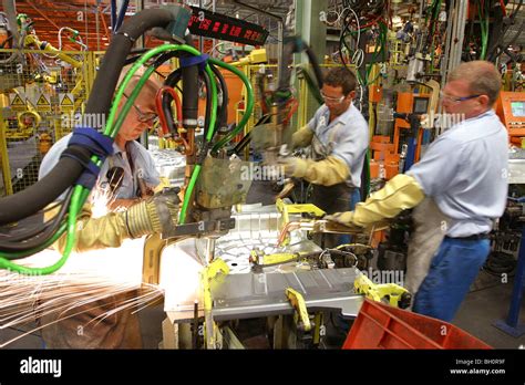 factory workers in a car factory Stock Photo - Alamy