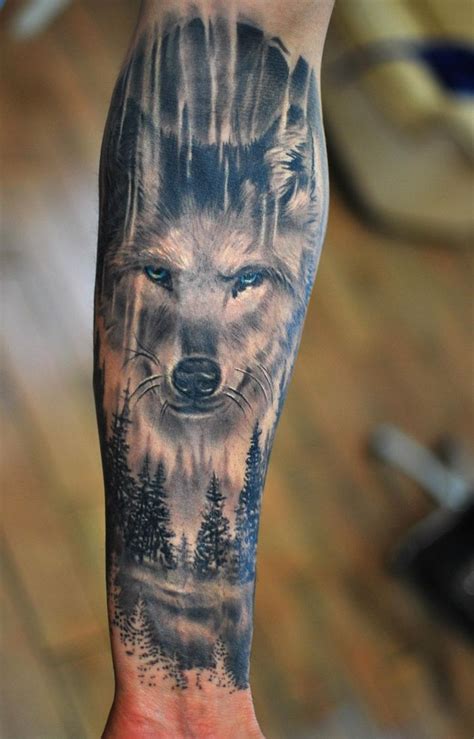 large wolf head, over a forest landscape, forearm tattoo, cool small tattoos, blurred background ...