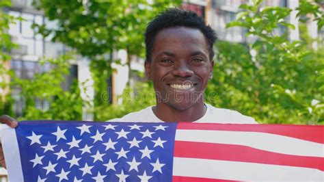 Close Up Smiling Afro-american Man Holding American Flag Looks Camera in Summer Stock Footage ...