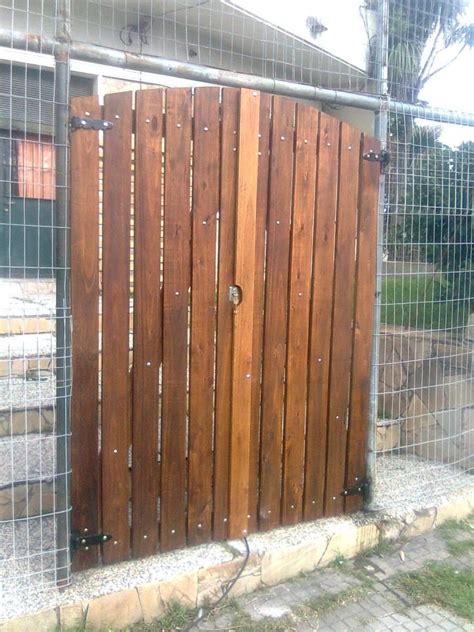 the gate is made of wood and has rivets on it's sides