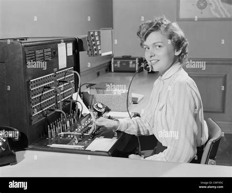 1950s SMILING WOMAN OFFICE TELEPHONE SWITCHBOARD OPERATOR Stock Photo - Alamy