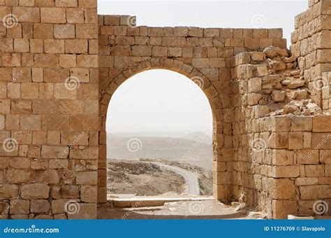 Ancient Stone Arch and Wall with Desert View Durin Stock Image - Image of desert, fortification ...