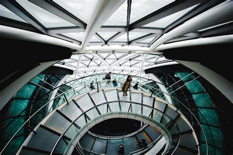 Woman Standing On Spiral Staircase · Free Stock Photo