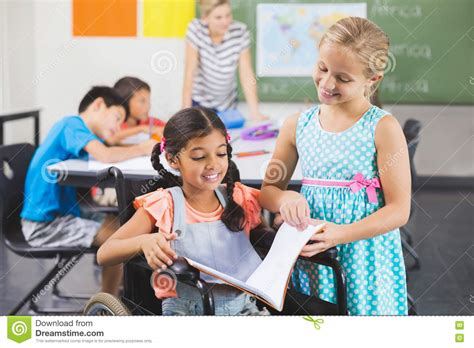 School Kids Reading Book In Classroom Stock Photography | CartoonDealer ...