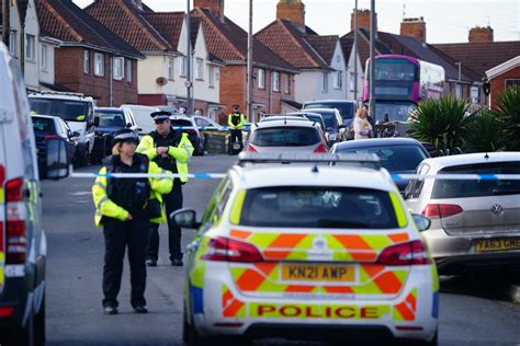 police at the scene of two teenage boys aged 15 and 16 stabbed to death ...